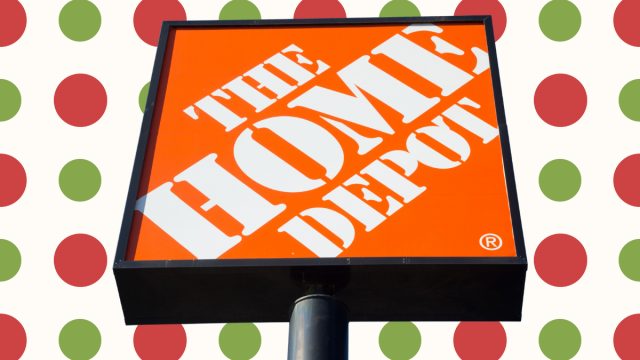 home depot sign with a red and green polka dot background
