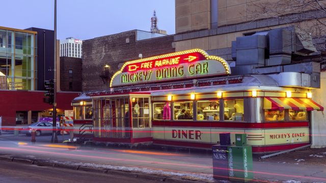 A Medium Shot of St Paul's Mickey's Dining Car with the First Building Sign in the Background