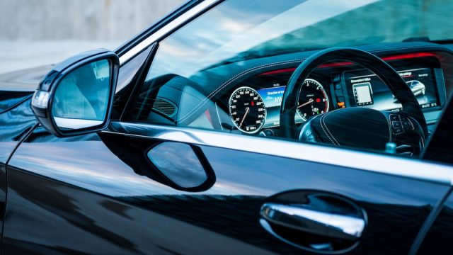 view in the driver's side window of a black car